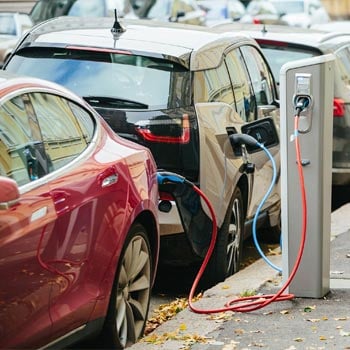 Electric car charging at charging station